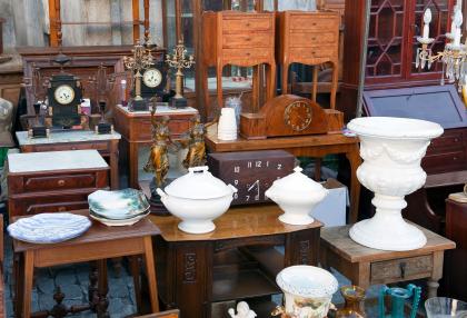 Furniture items at an auction.