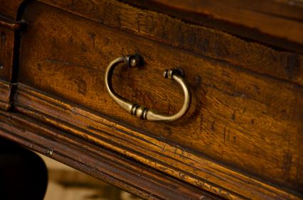 Aged and worn desk drawer.